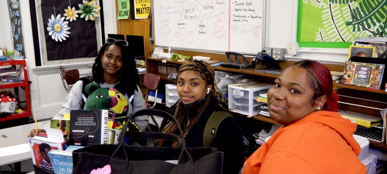 Students pose in class