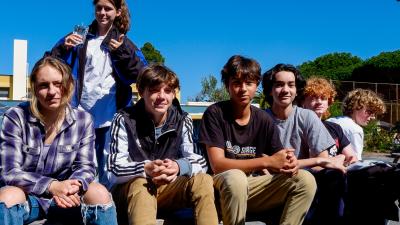 student pose in a group outside