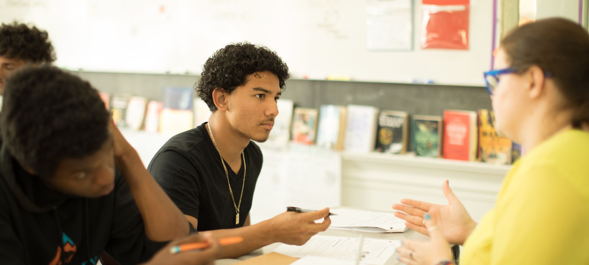 A teacher counsels a male student