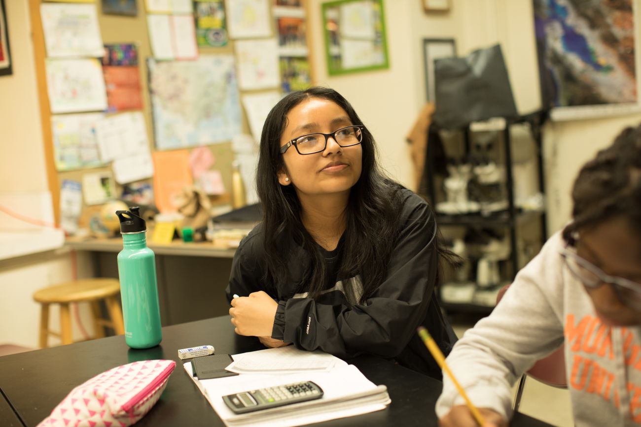 Female student taking notes