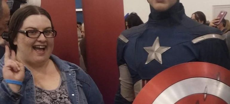 Danielle Smith poses with a wax figure of Captain America